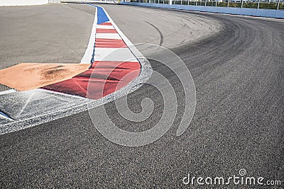 Texture of motor race asphalt and red white curb. Close up on Grand Prix street circuit Stock Photo