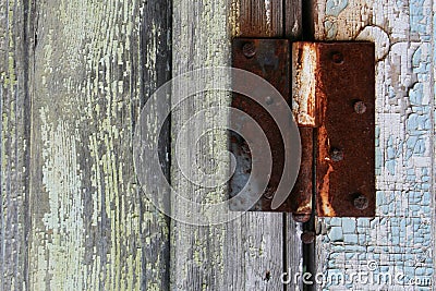 The texture is natural, old, wooden, with a shabby green paint, with a metal, rusty connecting part. Stock Photo