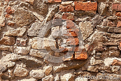 Texture of an old broken red brick wall with cement mortar Stock Photo