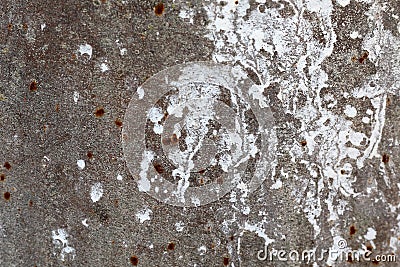 Texture of an old concrete wall with loose plaster and drops of white paint Stock Photo