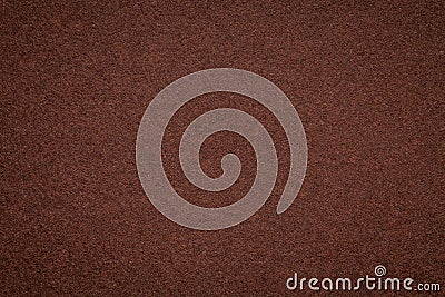 Texture of old dark brown paper background, closeup. Structure of dense umber cardboard Stock Photo