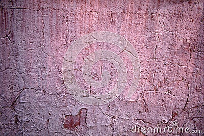 Texture of old pink peeling paint on the wall in the cracks Stock Photo