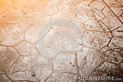 Texture of the old road with cracks. Asphalt surface on the street. Glare of light Stock Photo