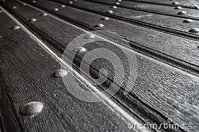 Texture of old wooden plank door with iron rivets Stock Photo