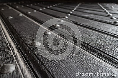 Texture of old wooden plank door with iron rivets Stock Photo