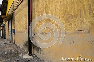 Texture of old yellow vintage wall of industrial factory Stock Photo