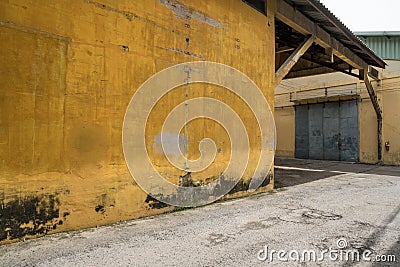 Texture of old yellow vintage wall of warehouse Stock Photo