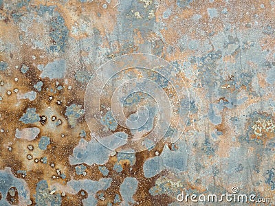 Texture of oxidized metal with brass and aqua patina. Rusty metal surface with streaks of rust. Rusty corrosion. Brown Stock Photo