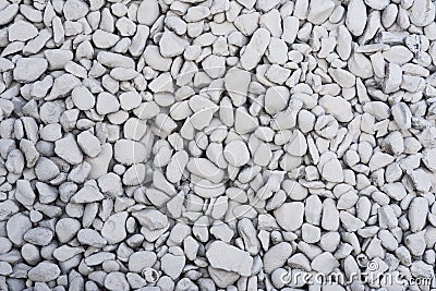 Texture: Pale grey rock chippings / aggregate background. 4 Stock Photo