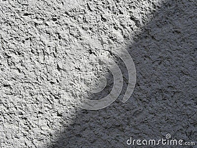 Texture of a part of a gray concrete wall with shadow Stock Photo