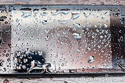 Texture phone which is filled in with water. Drops on the black smartphone Stock Photo