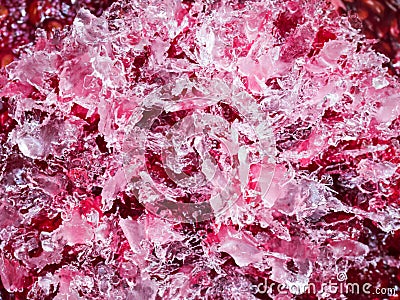 Texture of pink frozen water crystals, close up, top view Stock Photo