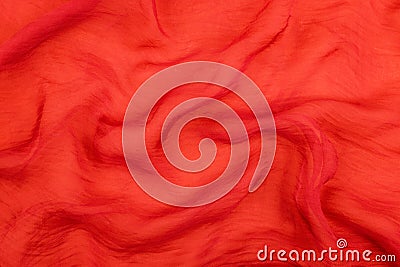 Texture of the red soft chiffon fabric with folds. Closeup of rippled red silk fabric Stock Photo