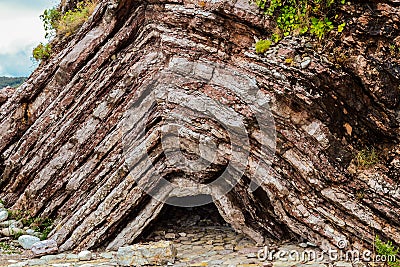 Texture of the rock. Large rocks exfoliate from the rock. Stock Photo