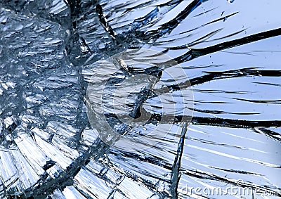 Texture of shiny blue mirror surface with small and large cracks Stock Photo