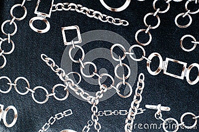 texture of silk fabric. background. costume jewelery chain with Stock Photo