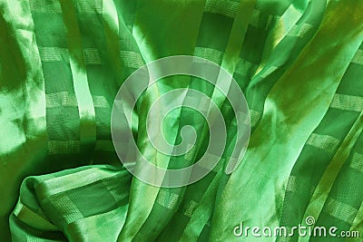 Texture of silk green fabric with pleats Stock Photo