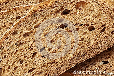 Texture of slice dark rye bread with seeds and bran, background Stock Photo