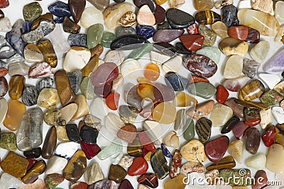 Texture of small coloured semi-precious stones. Stock Photo