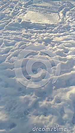 The texture of the snow cover in winter with traces Stock Photo