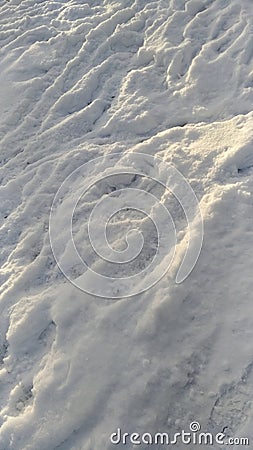 The texture of the snow cover in winter with traces Stock Photo