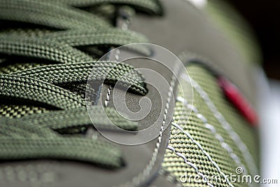 Texture of sports shoes knotted laces on gumshoes fashionable Stylish sneaker close-up Stock Photo