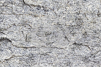 Texture of a stone wall with cracks and scratches which can be used as a backgr. Stock Photo