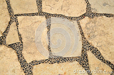 Texture of a stone wall, roads from stones, bricks, cobblestones, tiles with sandy seams of gray ancient . The background Stock Photo