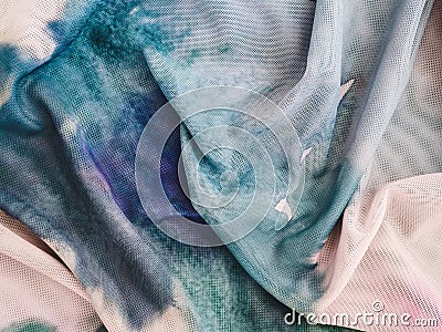 texture of translucent mesh blouse close-up. Polyester fabric painted in watercolor technique Stock Photo