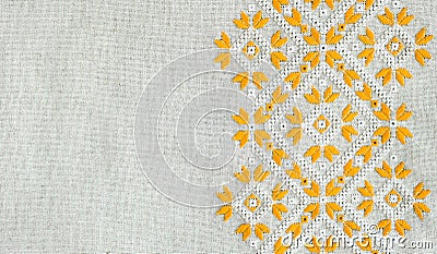 Texture of the vintage homespun linen textile with embroidery. Design of ethnic pattern. Craft embroidery. Stock Photo