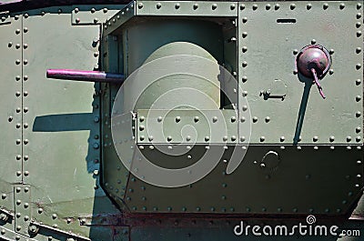The texture of the wall of the tank, made of metal and reinforced with a multitude of bolts and rivets. Images of the covering of Stock Photo