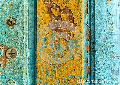 Texture wallpaper old door numerous layers of old paint. Stock Photo