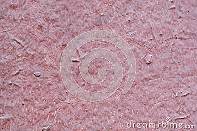 The texture of the walls of wood painted with red paint. Visible cracks, bumps and depressions. Stock Photo