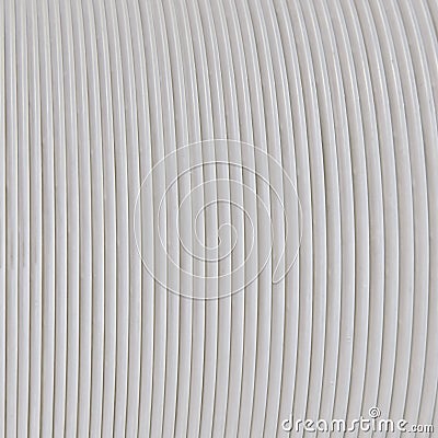 Texture of white wires wound on a round base, close-up background Stock Photo