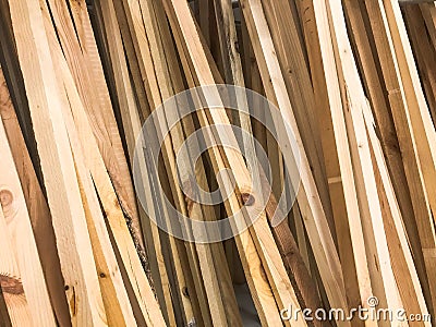 Texture of wooden brown diagonally tilted natural building boards sticks with knots. The background Stock Photo