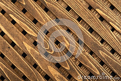 Texture of the wooden lattice. Natural wooden diagonal lattice. Close-up Stock Photo