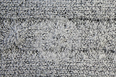 Texture wool, knitt, horizontal line, material witha pattern `pigtail`, gray , close-up. Stock Photo