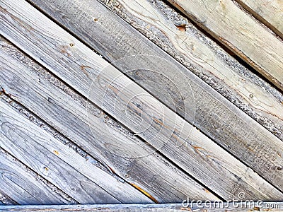 Textured wooden background featuring angled planks that create a rustic, weathered look ideal for design projects Stock Photo