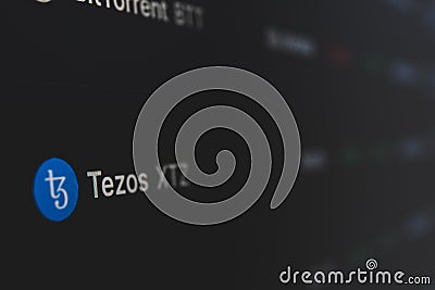 Tezos on cryptocurrency exchange market . A cryptocurrency is a digital or virtual currency that uses cryptography for security Editorial Stock Photo