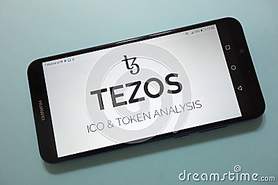 Tezos XTZ cryptocurrency logo displayed on smartphone Editorial Stock Photo