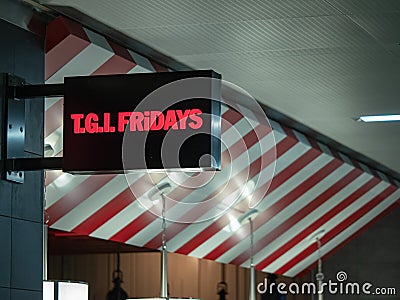 TGI Fridays banner logo at Hartsfield Jackson Atlanta International Airport Editorial Stock Photo