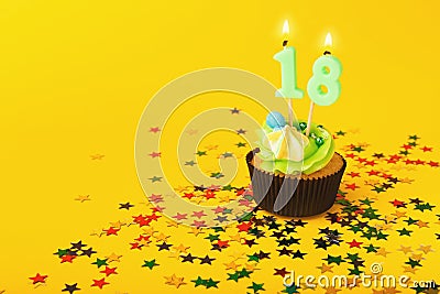 18th birthday cupcake with candle and sprinkles Stock Photo