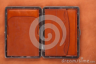 19th century old leather wallet on leather background Stock Photo