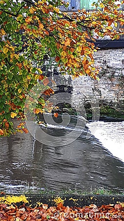 The River Calder from the bridge across it in Padiham own Centre. This river powered 20 cotton weaving Mills in 1906,all Stock Photo