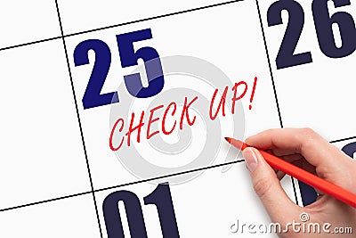 25th day of the month. Hand writing text CHECK UP on calendar date Stock Photo