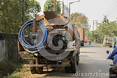 12th December, 2021, Kolkata, West Bengal, India: A water tanker truck standing road side with selective focus. Selective focus Editorial Stock Photo