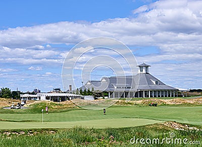 The 18th green and the clubhouse of Trump Golf Links at Ferry Point, Bronx, NYC Editorial Stock Photo