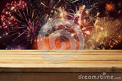 4th of July fireworks background with empty wooden table. Independence day of America Stock Photo