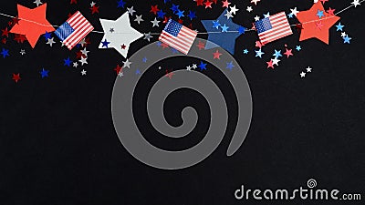 4th of July Independence Day decorations on dark background. Blue red white confetti, stars in USA national colors and American Stock Photo