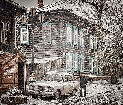 16th of October 2016, Russia, old man cleans his car Editorial Stock Photo